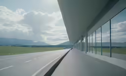 a view of an empty roadway and mountains