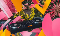 the black keyboard sits between several different pieces of cardboard