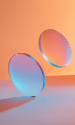 three round objects in front of an orange background