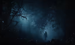 a man walking through a dark forest under street lights