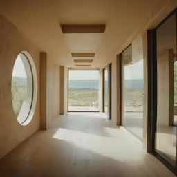 the large room has round windows near it