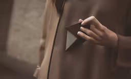 the woman is holding her black and white umbrella