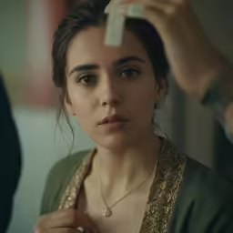 a beautiful woman is getting ready to brush her hair