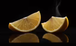 some sort of yellow fruit sitting on a black table