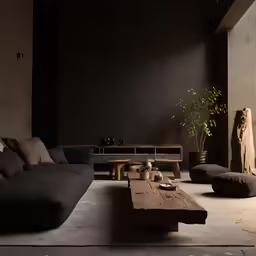 there is a large sofa and coffee table in the room