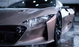 a luxury sports car is shown with front lights