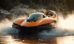 an orange race car is driving through the water