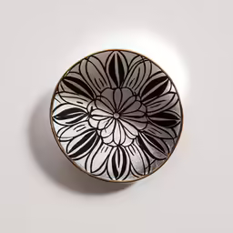 the black and white flower design on this dish is designed to resemble a pattern