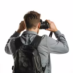 a man in a jacket taking pictures with his camera