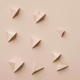 a variety of triangles on beige paper
