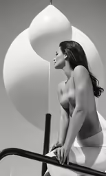 nude woman with no bra posing in an artistic setting