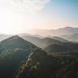 a view of hills and valleys at dusk