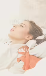 a woman with her head turned looking to the side