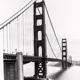 a picture taken from a boat of a long bridge