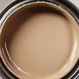 close up view of a white paint with a brown base