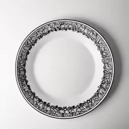 an empty plate with black design on it