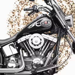 a black motorcycle on the ground with pebbles