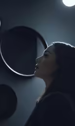 a woman standing next to two circular mirrors