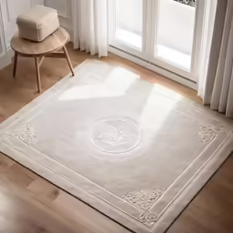 a white rug with an intricate pattern on the floor
