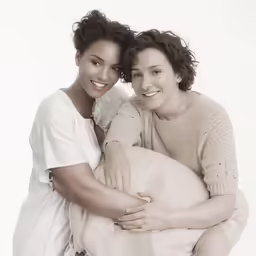 two young women posing for the camera