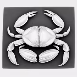metal crab made out of different pieces of silver