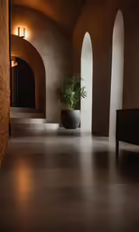 an indoor area features concrete walls and a potted plant