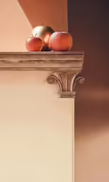 two apples sit on a ledge above other fruit