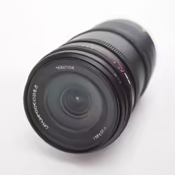 a camera lens on a white surface with an extended lens