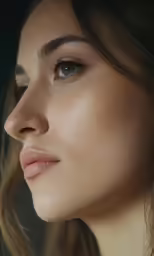 a beautiful young woman with long eyelashes staring ahead