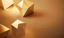 some origami paper on a brown table