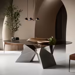 the dining table has an unusual base and leaves inlay