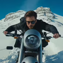 a man in sunglasses riding on a motorcycle