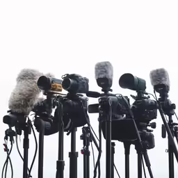 a series of camera rigs lined up for filming
