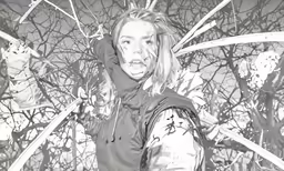 a young woman with tattoos on her face is standing in front of a large group of branches