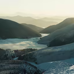 a view of snow covered mountains near the ground