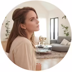 a woman is staring out into the distance