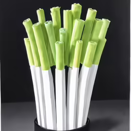 several different colored bamboo sticks are in a round vase
