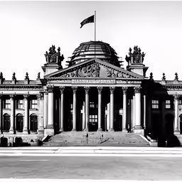 an old building with three columns and some flags