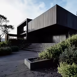 a building with a concrete stair outside in the day