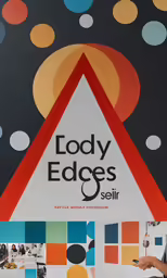 a poster for a school with a colorful triangle