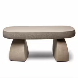an upholstered bench with rounded legs and a curved seat