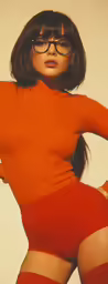 a woman wearing glasses and a red dress