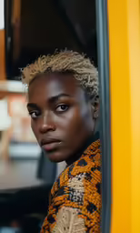 a woman is seen from behind inside a bus