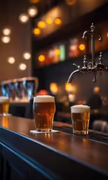 three beers in glass sitting on a bar