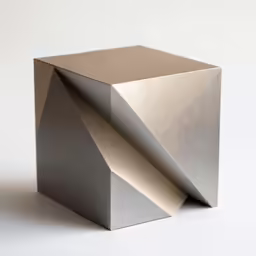 a metal cube with a white backdrop