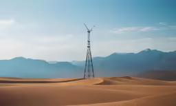 the top of a tall metal tower in the desert