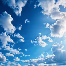 there is a boat on the water in front of clouds