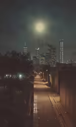 the night view of a city from an empty street