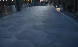 a view down an empty walkway in a city