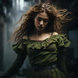 a woman in a dress and with long hair is looking down